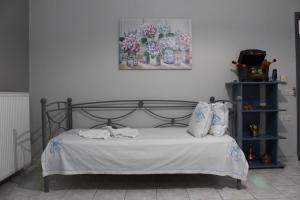 Postel nebo postele na pokoji v ubytování Tzaneria Apartments Skiathos