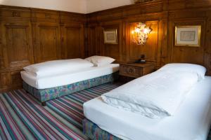 Postel nebo postele na pokoji v ubytování Hotel Schrenkhof
