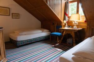 Postel nebo postele na pokoji v ubytování Hotel Schrenkhof