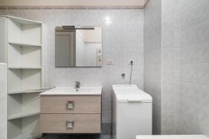 A bathroom at Piazza de' Calderini Apartment by Wonderful Italy