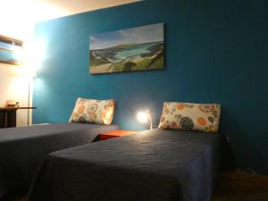 Postel nebo postele na pokoji v ubytování B&B MrCaruba