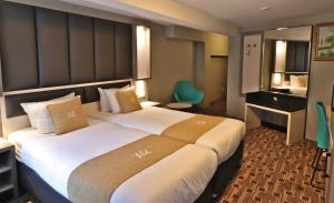 Krevet ili kreveti u jedinici u okviru objekta XO Hotels City Centre