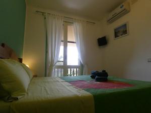 Postel nebo postele na pokoji v ubytování B&B MrCaruba