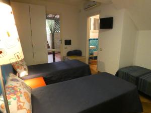 Postel nebo postele na pokoji v ubytování B&B MrCaruba