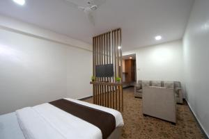 Postel nebo postele na pokoji v ubytování Hotel Jurkis, Kolhapur