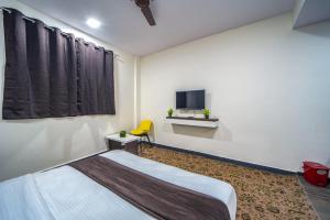 Postel nebo postele na pokoji v ubytování Hotel Jurkis, Kolhapur