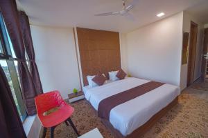 Postel nebo postele na pokoji v ubytování Hotel Jurkis, Kolhapur