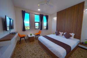 Postel nebo postele na pokoji v ubytování Hotel Jurkis, Kolhapur