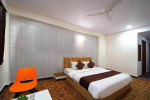 Postel nebo postele na pokoji v ubytování Hotel Jurkis, Kolhapur