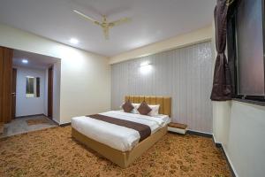 Postel nebo postele na pokoji v ubytování Hotel Jurkis, Kolhapur