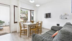 a living room with a couch and a table at 1Blan - Llafranc in Llafranc