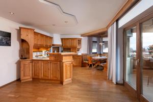 Kuchyň nebo kuchyňský kout v ubytování Alpine View Apartments