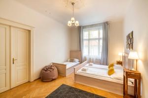 a bedroom with two beds and a window at Templová 7 - Old Town Apartments in Prague