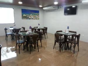 Um restaurante ou outro lugar para comer em Inter Hotel