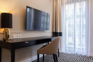 Televízia a/alebo spoločenská miestnosť v ubytovaní VacationClub – Baltic Park Fort Apartament F.210