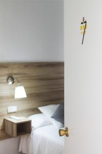 Postel nebo postele na pokoji v ubytování Hotel Restaurante Vía Sevilla - Cádiz by MA 22 Puntos