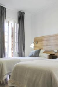Postel nebo postele na pokoji v ubytování Hotel Restaurante Vía Sevilla - Cádiz by MA 22 Puntos