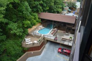 an aerial view of a building with a pool and a truck at Edgewater Hotel and Conference Center in Gatlinburg