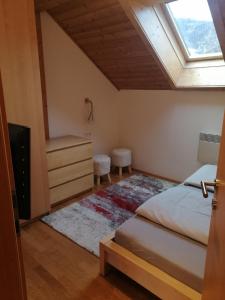 A bed or beds in a room at Appartement Moni / Golf & Ski - TOP 9