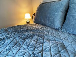 A bed or beds in a room at Athens Skylight Condo