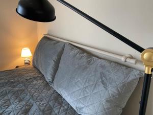 A bed or beds in a room at Athens Skylight Condo