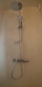 a shower head on a wall in a room at La Conchee in Saint Malo +17 photos