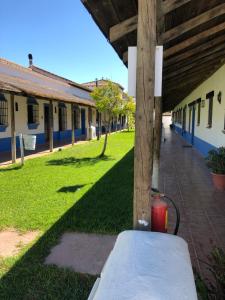 a pole with a fire hydrant on the side of a building at CASA KIKA ROCIO in El Rocío
