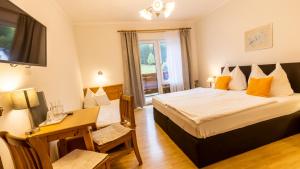 Voodi või voodid majutusasutuse Alpenhotel Ensmann toas