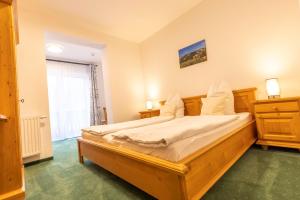 Voodi või voodid majutusasutuse Alpenhotel Ensmann toas