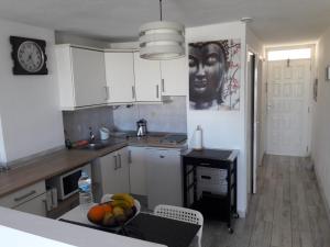 Η κουζίνα ή μικρή κουζίνα στο Borinquen con vista mar