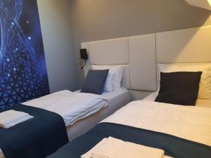 Postel nebo postele na pokoji v ubytování Kaposvár Apartman