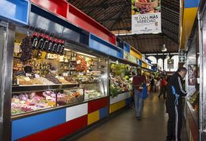 a group of people walking through a market at Stunning Villa near Velez-malaga in Arenas