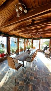 a large dining room with a long table and chairs at Casa Mara in Breaza +44 photos