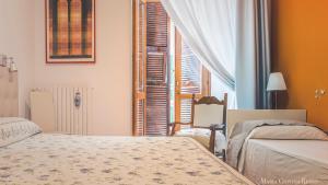 Postel nebo postele na pokoji v ubytování Casa in Centro Foggia