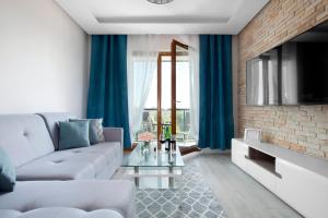 Telewizja i/lub zestaw kina domowego w obiekcie Elite Apartments Sunny