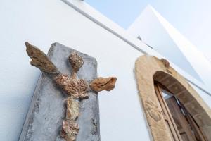 a large bird perched on top of a building at F Charm Hotel - Adults Only in Lindos