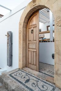 
a doorway leading to a room with a door leading to a room with a at F Charm Hotel - Adults Only in Líndos
