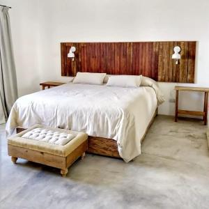 En eller flere senge i et værelse på LA FLORIDA - CASA PUEBLO