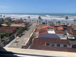 a view of the beach from the roof of a building at REFÚGIO DA SEREIA ARIEL in Mongaguá