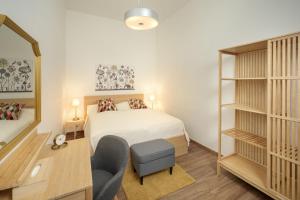 
Postel nebo postele na pokoji v ubytování Unesco Prague Apartments
