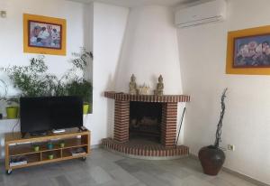 TV a/nebo společenská místnost v ubytování Villa Andaluza