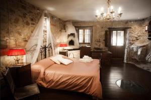 Postel nebo postele na pokoji v ubytování B&B La Voce del Fiume Dimora storica di Charme