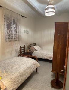 Katil atau katil-katil dalam bilik di La Figuera