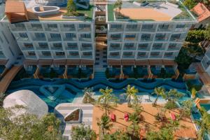 an aerial view of a resort with a swimming pool at Andaman Embrace Patong, Phuket in Patong Beach