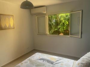 Postel nebo postele na pokoji v ubytování Joli appartement rénové à neuf