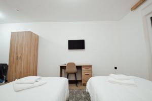 Voodi või voodid majutusasutuse Zlatna Nit toas