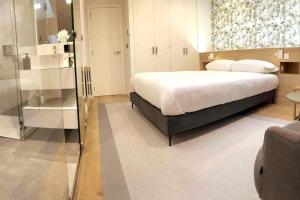 En eller flere senger på et rom på H70 Apartamento exclusivo Luxury apartments