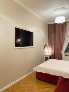 Postel nebo postele na pokoji v ubytování Grand de Luxe Residence Lviv