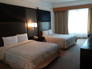 Postelja oz. postelje v sobi nastanitve Hospedium Princess Hotel Panamá