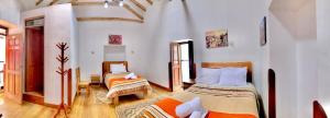 Voodi või voodid majutusasutuse Casa Union Cusco toas